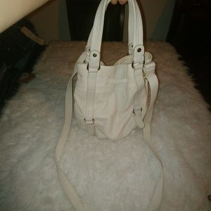 The Sak cream bucket bag